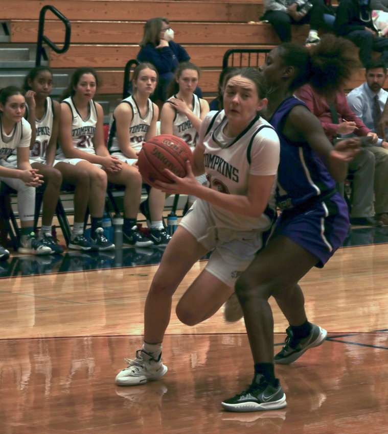 Tompkins Macy Spencer drives to the basket during Friday&rsquo;s game against Morton Ranch at the Tompkins gym
