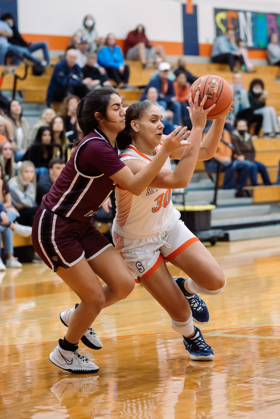 Seven Lakes Justice Carlton drives to the basket during Tuesday's game against Cinco Ranch.