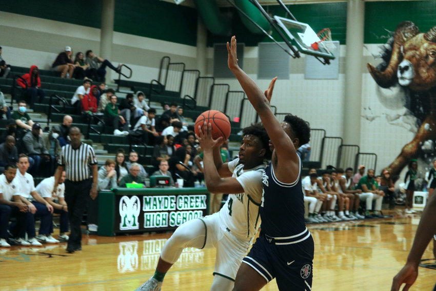 Angel Sonnier drives to the basket during Wednesday&rsquo;s game between Mayde Creek and Tompkins at the Mayde Creek gym.