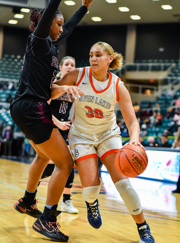 Katy Tx. Feb 25, 2022:  Seven Lakes Justice Carlton #30 drives the baseline to the basket during the Regional SemiFinal playoff game, Seven Lakes vs Pearland at the Merrell Center. (Photo by Mark Goodman / Katy Times)