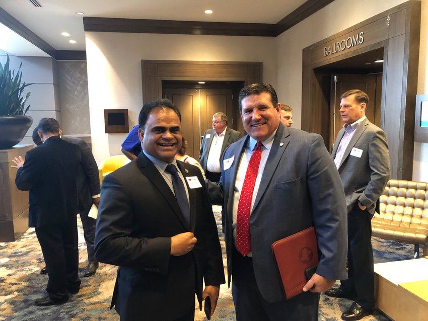 Fort Bend County Judge KP George and Waller County Judge Trey Duhon visit before the State of the Counties luncheon staged by the Katy Area Chamber of Commerce.
