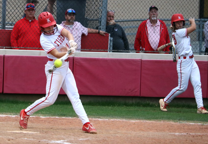 Hailey Gore hits during Tuesday&rsquo;s game between Katy and Taylor at the Katy softball field.