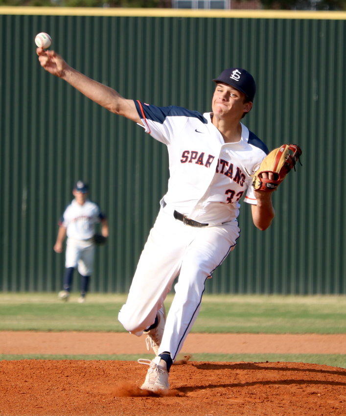 Nathan Johnson pitches during a District 19-6A  game between Seven Lakes and Cinco Ranch at the Seven Lakes baseball field.