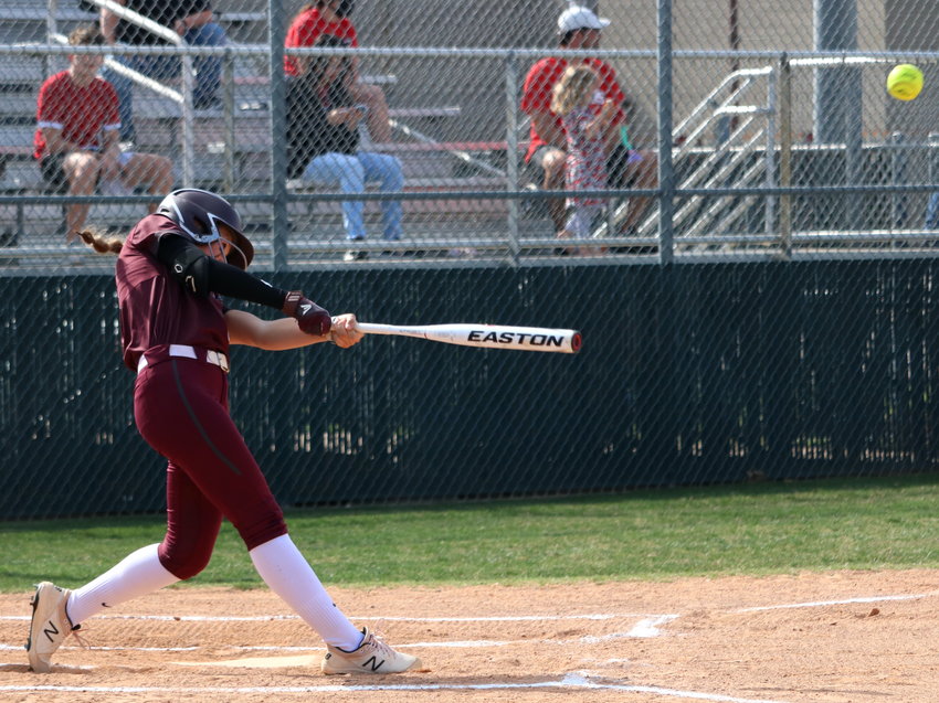 Faith Piper hits during Friday&rsquo;s bi-district game between Cinco Ranch and Fort Bend Travis.