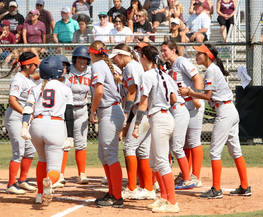 Amy Abke heads towards home plate as her teammates celebrate an Abke home run during Saturday&rsquo;s Class 6A Regional Quarterfinal game between Seven Lakes and George Ranch at the George Ranch softball field.