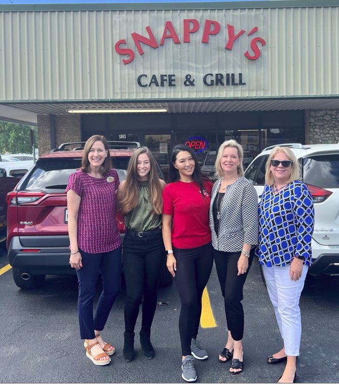 Stephanie Husmann, Emilee Paul, Anna Liu, Catherine Reilly and Lisa Kenny stand outside of Snappy&rsquo;s as they prepare for a Saturday fundraising event. Liu is the owner of Snappy&rsquo;s. Husmann, Paul, Reilly and Kenny are all with DMR Mortgage.