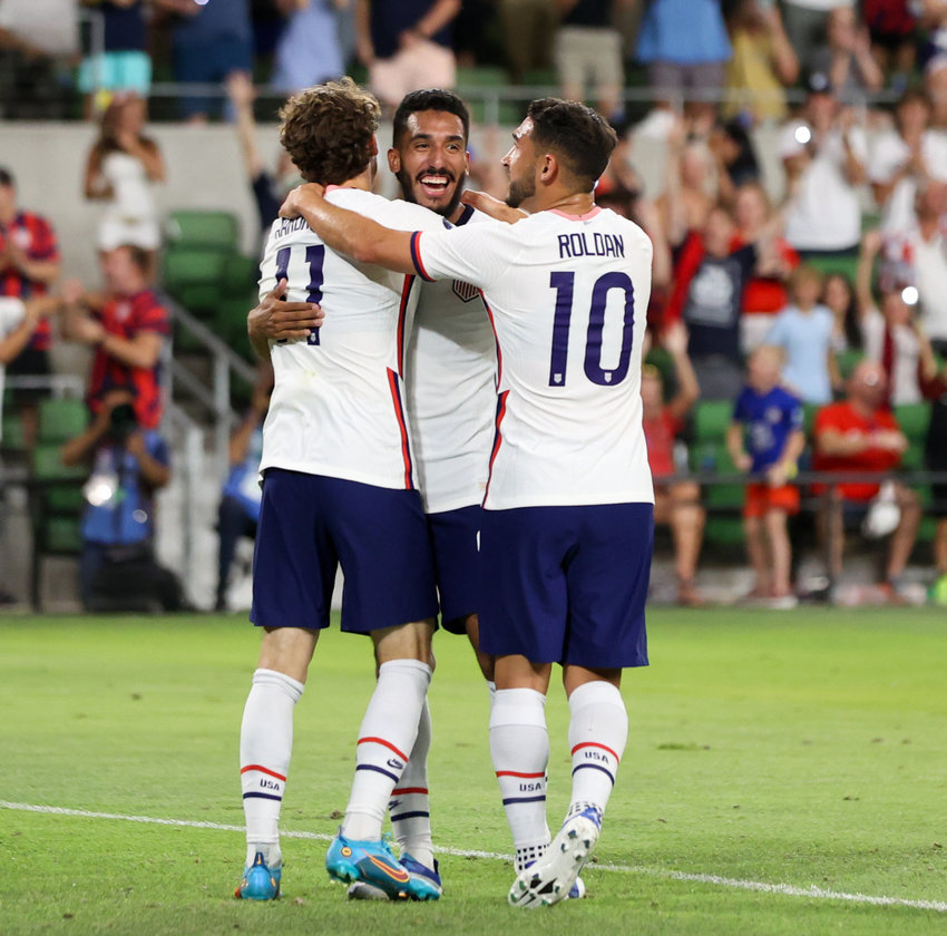 United States forward Brendan Aaronson (11) and forward Christian Pulisic (10) congratulate forward Jesus Ferriera  (center) after a goal during a Concacaf Nations League match on June 10, 2022 in Austin, Texas. Ferriera scored four of the USA&rsquo;s five goals in the 5-0 win over Grenada.