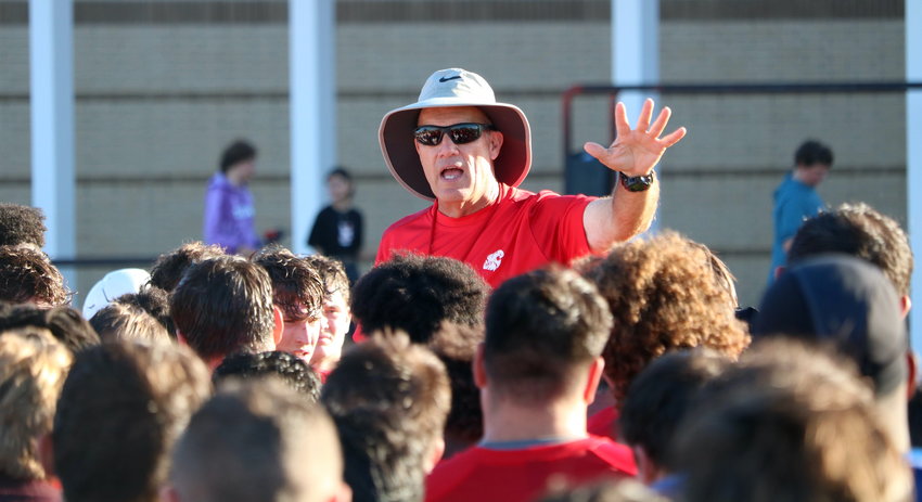 Katy head coach Gary Joseph talks to his team after Monday&rsquo;s practice.