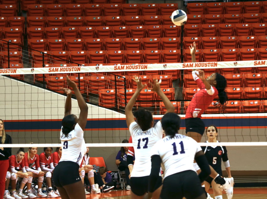Katy's Kennedy Pike hits a spike during last years Class 6A Region III final at Sam Houston State University.