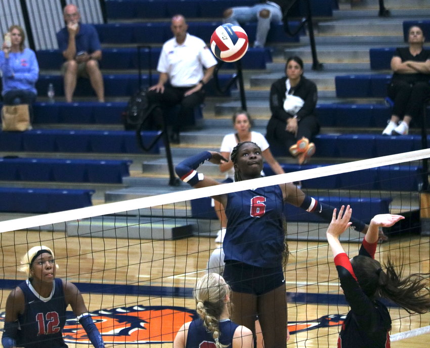 Tompkins&rsquo; Simi Elliott spikes a ball against Canyon in the finals match of gold bracket Katy ISD/Cy-Fair Tournament at Bridgeland.