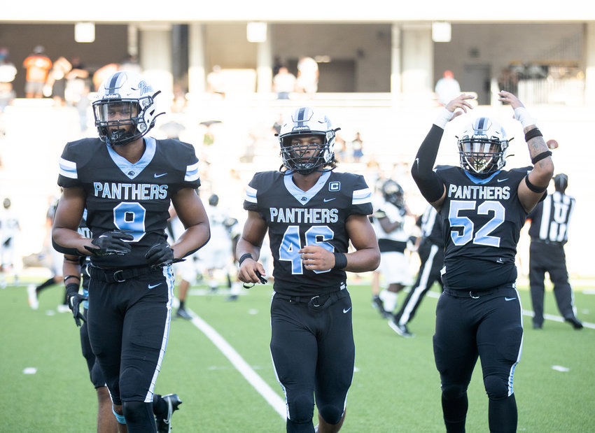 Paetow players celebrate as they come off the field after forcing a turnover during Friday&rsquo;s game against Conroe at Legacy Stadium.