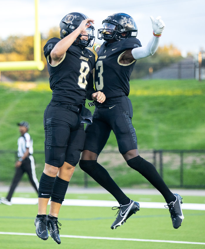 Jordan quarterback Colin Willetts and wide receiver Andrew Marsh celebrate after scoring a touchdown during Saturday&rsquo;s game between Jordan and Aldine Davis.