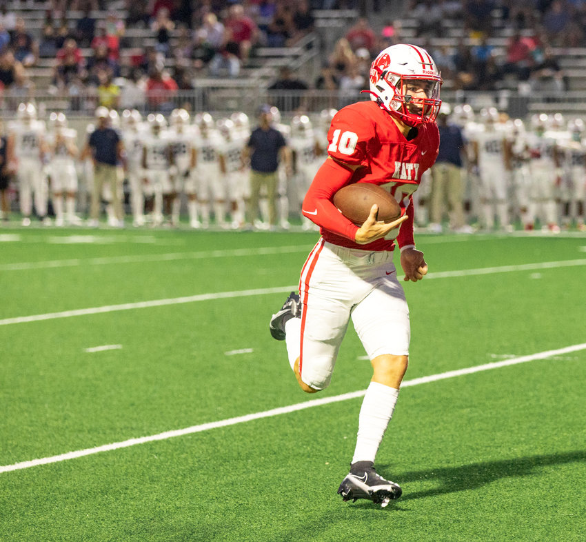 Katy&rsquo;s Caleb Koger runs in a touchdown during Friday&rsquo;s game between Katy and Atascocita at Legacy Stadium.