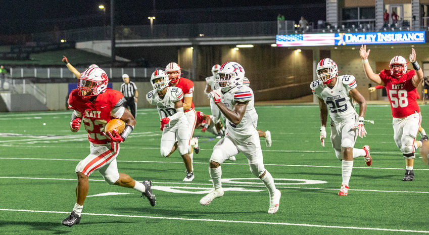 Katy&rsquo;s Seth Davis runs in a 57-yard touchdown during Friday&rsquo;s game between Katy and Atascocita at Legacy Stadium.