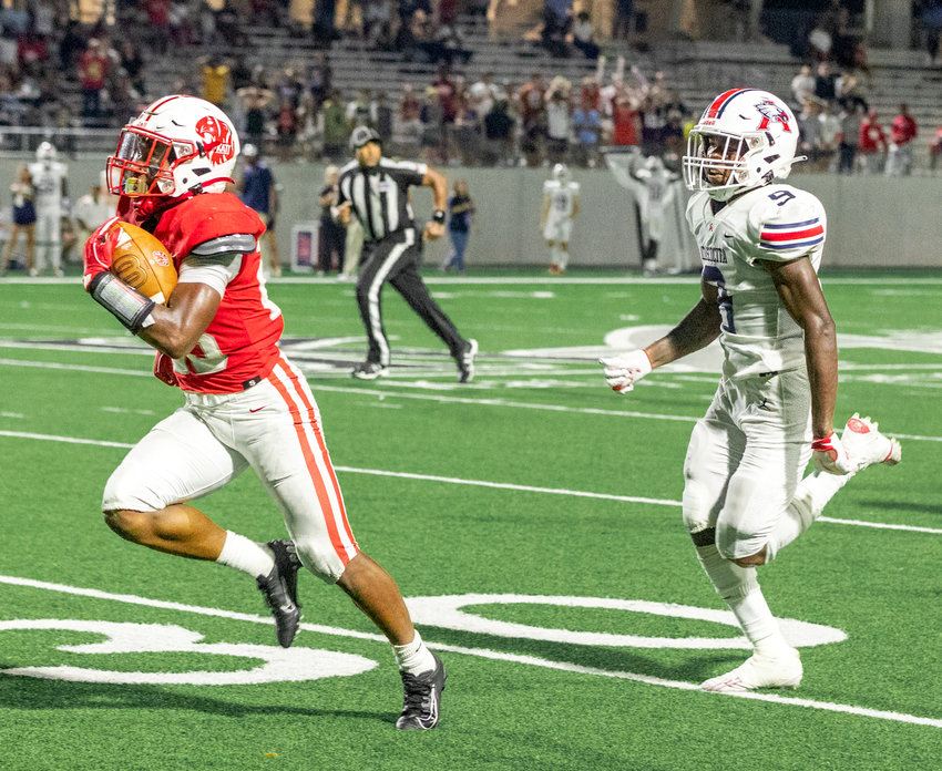Katy&rsquo;s Seth Davis runs in a 57-yard touchdown during Friday&rsquo;s game between Katy and Atascocita at Legacy Stadium.