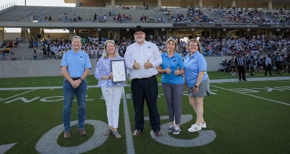 Harris County Pct. 4 Commissioner R. Jack Cagle, center, presented a proclamation honoring the Class 5A state champion Paetow football team before its Aug. 26 opener against Conroe at Legacy Stadium. Pictured with Cagle are, from left, trustee Greg Schulte, Paetow principal Mindy Dickerson, and trustees Dawn Champagne and Leah Wilson.