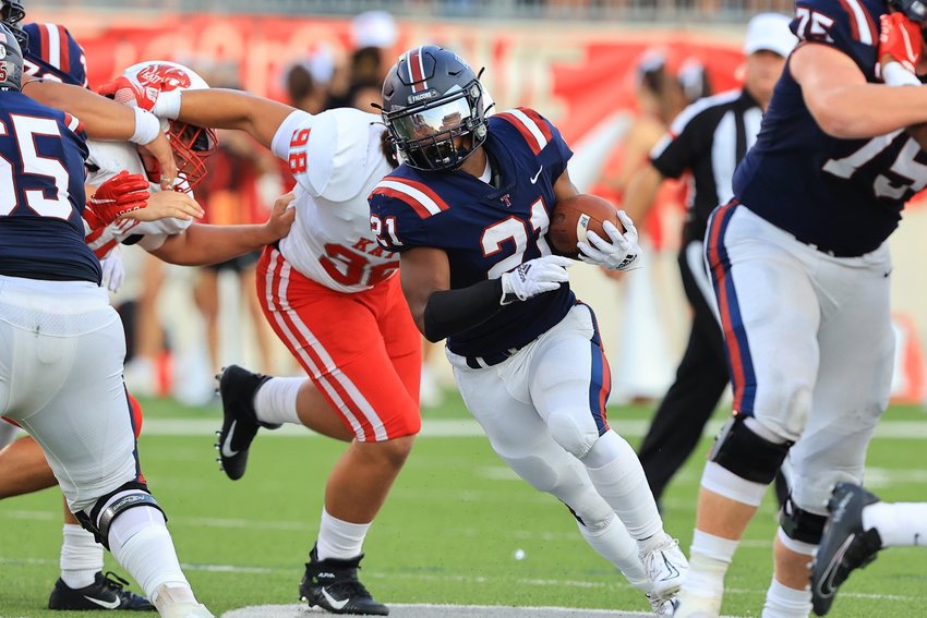 Tompkins Caleb Blocker rushes with the ball during Saturday&rsquo;s game between Katy and Tompkins at Legacy Stadium.