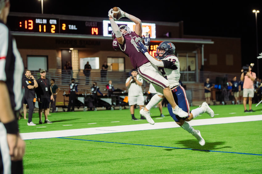 Cinco Ranch&rsquo;s Fischer Reed catches a touchdown during Friday&rsquo;s game between Cinco Ranch and Tompkins at Rhodes Stadium.