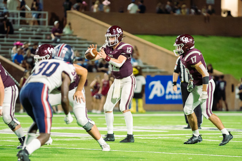 Cinco Ranch&rsquo;s Gavin Rutherford takes a snap during Friday&rsquo;s game between Cinco Ranch and Tompkins at Rhodes Stadium.