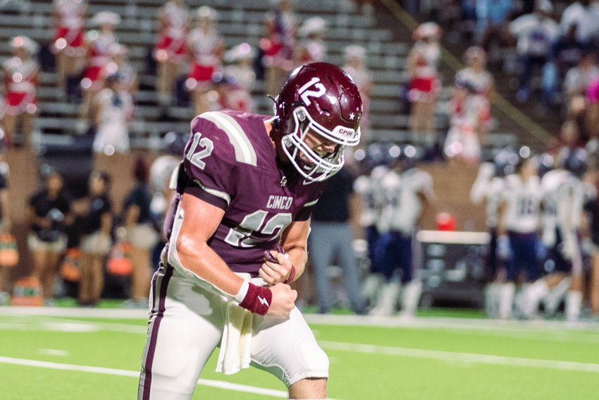 Cinco Ranch&rsquo;s Gavin Rutherford celebrates after throwing for a touchdown during Friday&rsquo;s game between Cinco Ranch and Tompkins at Rhodes Stadium.