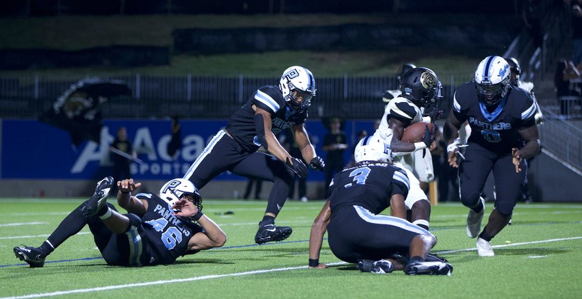 Paetow&rsquo;s DJ Hicks closes in on a Conroe ball-carrier to make a tackle.