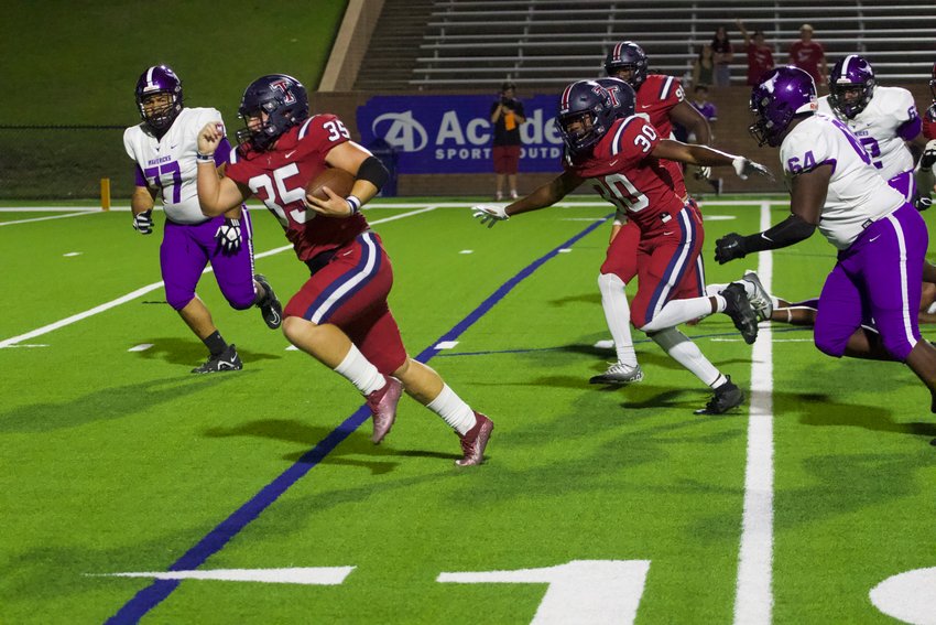 Griffin Simonton returns a fumble recovery for a touchdown during Thursday's game between Tompkins and Morton Ranch at Rhodes Stadium.