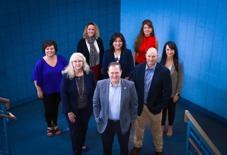 Chris Smith, the district&rsquo;s chief financial officer, is in front. On the second row are, from left, Sharri Butterfield, director of budget &amp; treasury and Jamey Hynds, executive director of finance. On the third row are Christy Alspaw, accounts payable manager; Gloria Truskowski purchasing &amp; distribution executive director, and Kayla Smith, accounting director. On the fourth row are Kristi Grant, payroll director, and Terri Nelson, assistant to the chief financial officer.