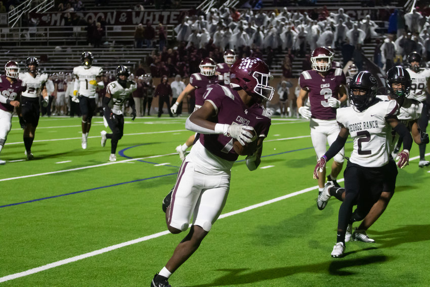 Sam McKnight runs down the sideline during Friday's game between Cinco Ranch and George Ranch at Rhodes Stadium.