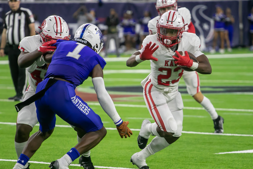 Seth Davis breaks a run outside during Friday's Class 6A-Division II Region III Final between Katy and C.E. King at NRG Stadium.