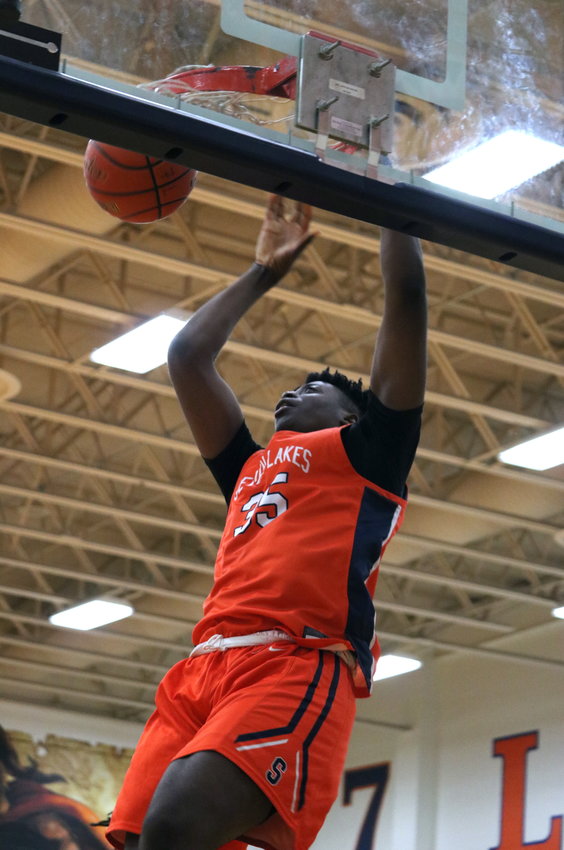 Josh Akpovwa dunks the ball during Monday&rsquo;s game during Monday&rsquo;s game between Seven Lakes and Mayde Creek at the Seven Lakes gym.