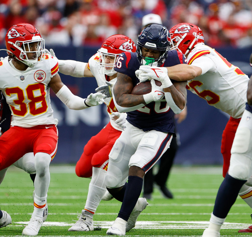 Houston Texans running back Royce Freeman (26) is tackled on a carry during an NFL game between the Texans and the Chiefs on Dec. 18, 2022, in Houston. The Chiefs won, 30-24, in overtime.