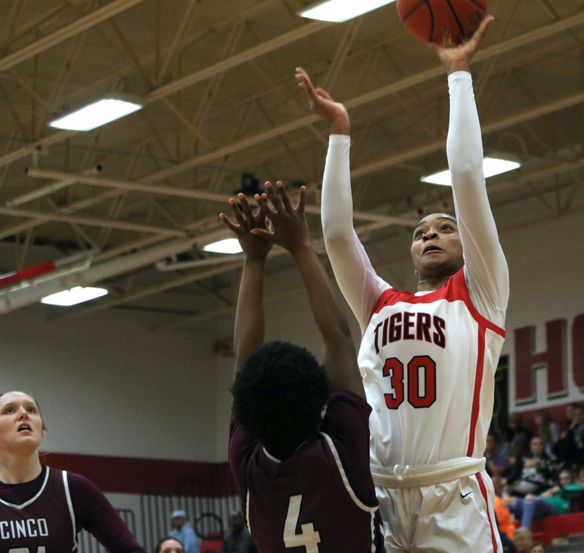 Lyric Barr shoots a layup over a Cinco Ranch defender during Tuesday&rsquo;s game between Katy and Cinco Ranch at the Katy gym.