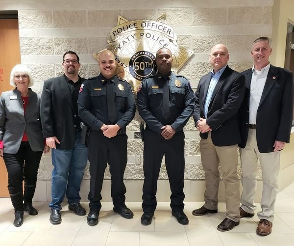 The Katy Police Department welcomed two new officers this month. Pictured from left to right are Ward A Council Member Janet Corte, Council Member-at-Large and Mayor Pro Tem Chris Harris, new officers Braulio Guerrero and David Beliard, Captain Byron Woytek and Mayor Dusty Thiele.