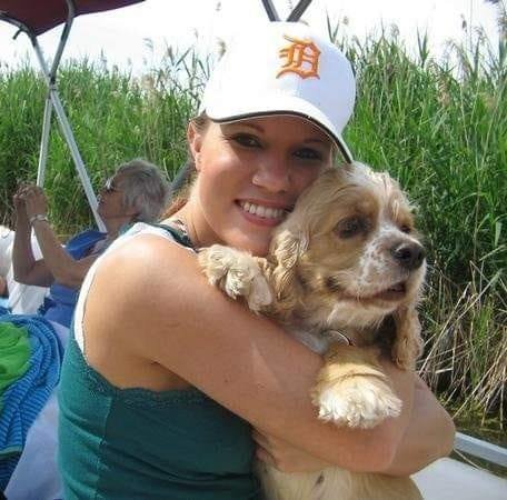 Chelsea Gerber holds her dog Downey in a 2010 photo.