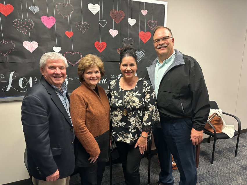David and Terri Youngblood visit with Cindie and Russell Faldyn after Katy school trustees named the district&rsquo;s newest elementary schools in their honor Monday.