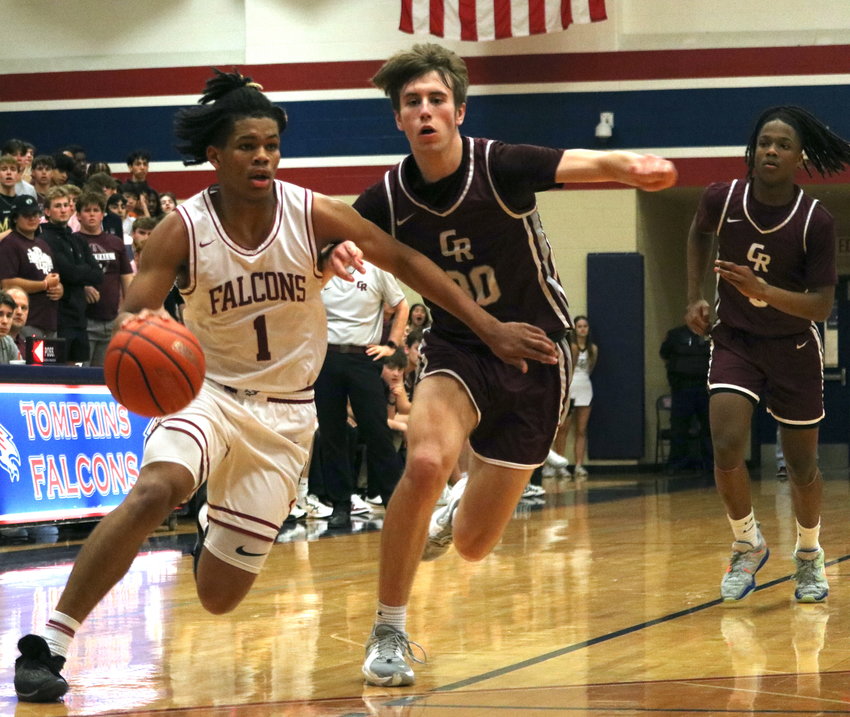 Scottie Guillory drives past a defender during Tuesday&rsquo;s game between Tompkins and Cinco Ranch at the Tompkins gym.