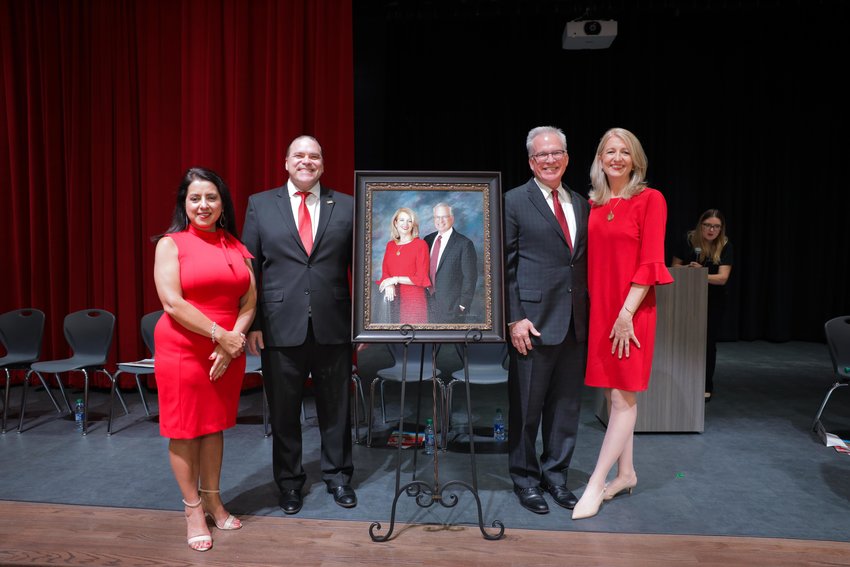 Robertson Elementary Principal Martha Pulido and Katy ISD Superintendent Ken Gregorski join Robertson Elementary namesakes Steve and Elaine Robertson for the unveiling of their portrait, which will be displayed in the school named in their honor.