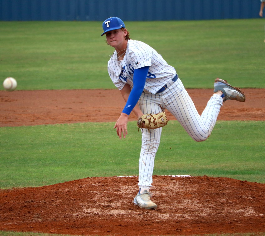 Bryce Krenek pitches during a game between Taylor and Seven Lakes at the Taylor baseball field.