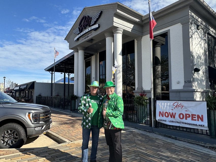 Bill Fanning, left, Katy Crossing Icehouse owner, and Don McCoy, Fulshear-Katy Area Chamber of Commerce president, show off their St. Patrick&rsquo;s Day attire in front of the icehouse.