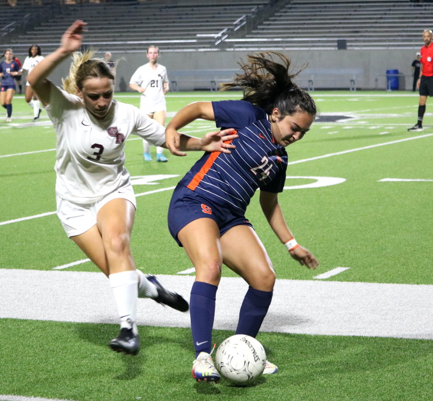 Allison Zuniga takes the ball away from a George Ranch player during a bi-district game between Seven Lakes and George Ranch at Legacy Stadium.