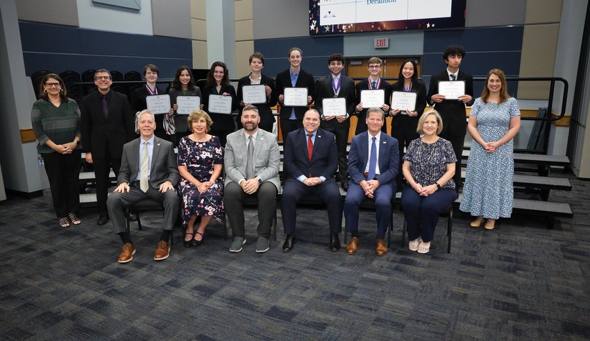 Katy ISD Superintendent Ken Gregorski, seated fourth from left, and Katy school trustees pose for a photo with the Taylor High academic decathlon team.