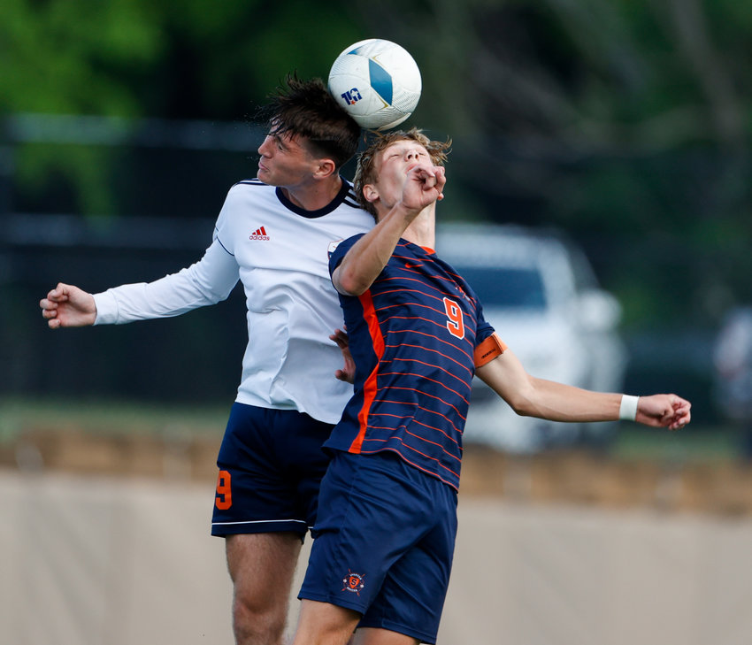 Sachse forward Ryan McMillan (9) and Seven Lakes forward Hunter Merritt (9) meet to head the ball during the Class 6A boys state semifinal soccer game between Seven Lakes and Sachse on April 14, 2023 in Georgetown.