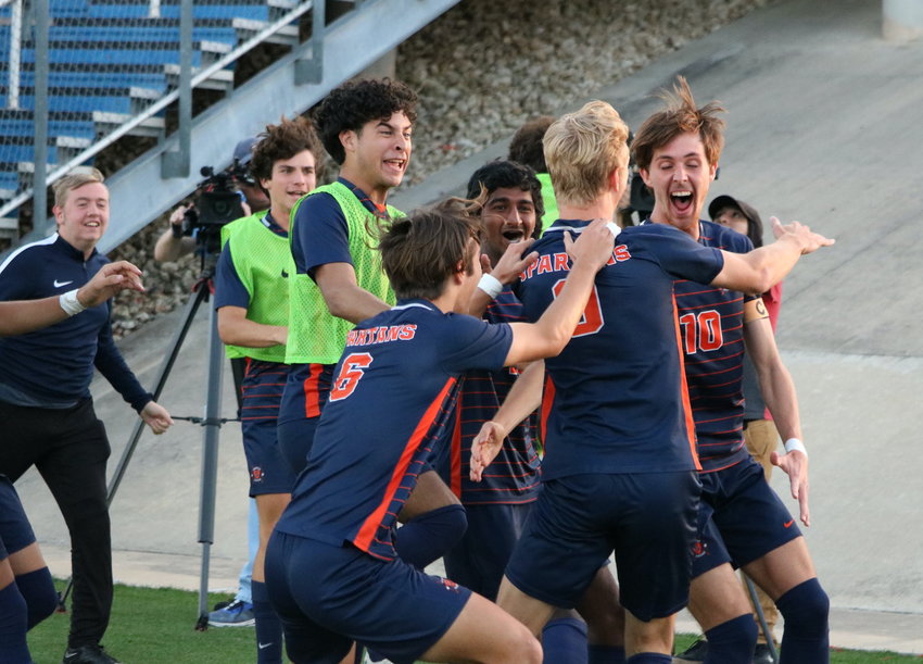 Seven Lakes players celebrate after a Hunter Merritt goal during Saturday's Class 6A State Final between Seven Lakes and Dripping Springs at Birkelbach Field in Georgetown.