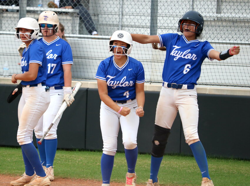 Taylor players celebrate during Monday's play in game between Taylor and Seven Lakes at the Jordan softball field.