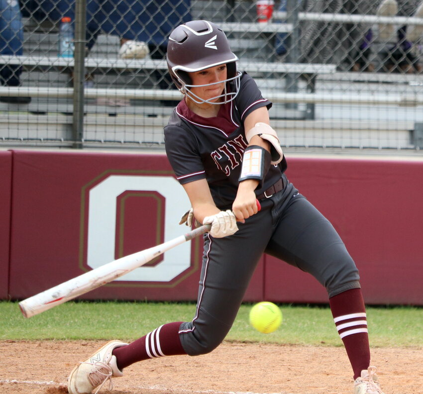 Kendall Bregenzer hits during Saturday's bi-district round game between Cinco Ranch and Fort Bend Travis at the Cinco Ranch softball field.