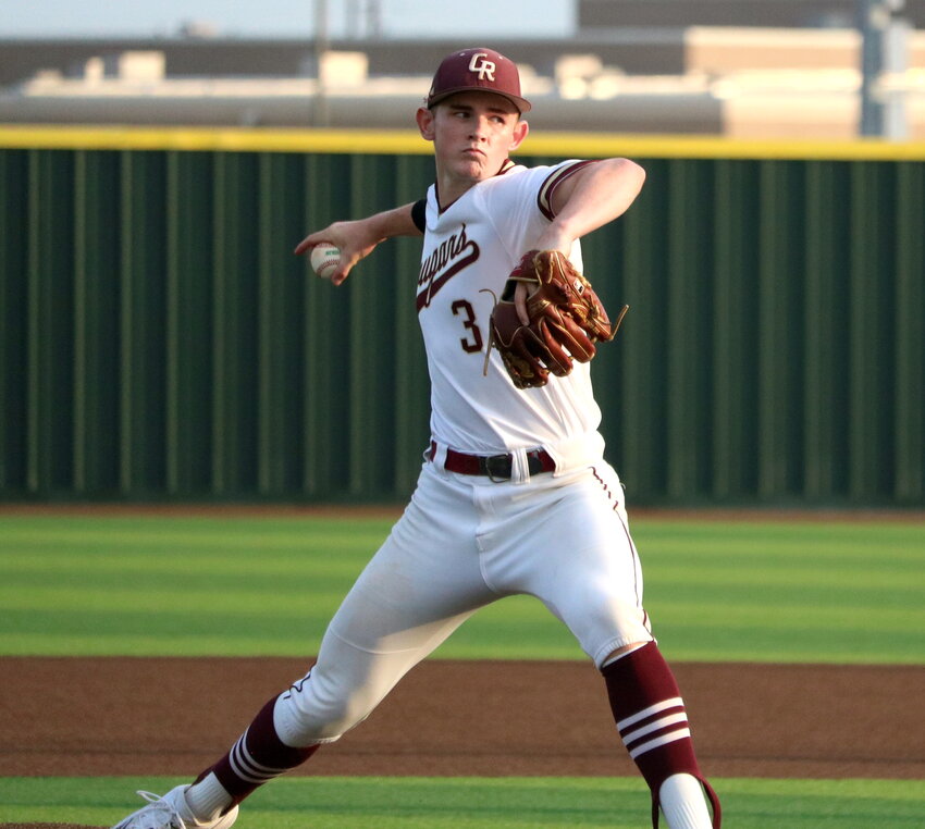 Parker Booth pitches during Thursday's area round game between Cinco Ranch and Memorial at Cy-Lakes.