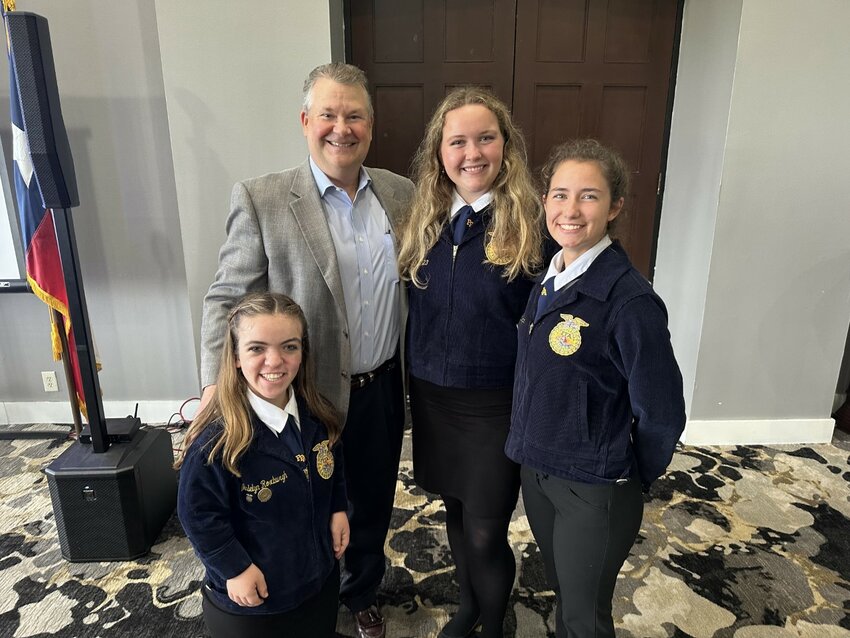 The Katy FFA is among the beneficiaries of the Wild West Brew Fest, which is put on by the Rotary Club of Katy. Taylor High FFA students, from left, Madelyn Roxburgh, Madison Webster and Cynethia Looper pose for a photo with David Loesch, Wild West Brew Fest president, at the May 11 Rotary Club of Katy meeting. Loesch said this year&rsquo;s brew fest raised over $180,000, a new record.