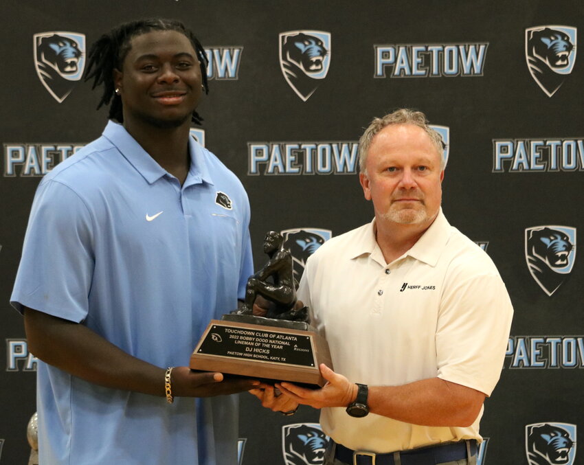 D.J. Hicks being presented with his National Lineman of the Year award.
