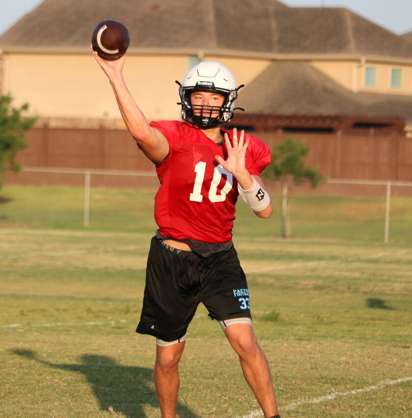 Brock Nichols makes a throw during Thursday's practice at the Paetow practice field.