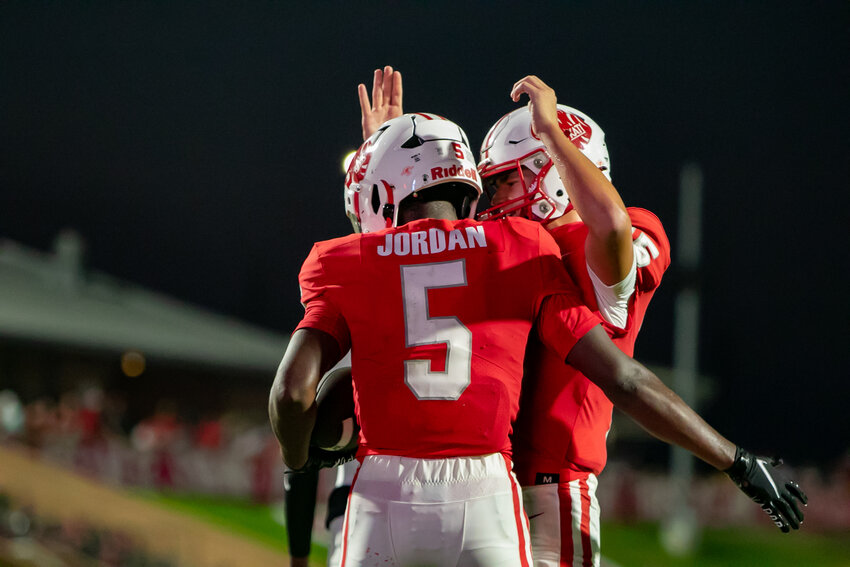 Romel Jordan and Gunner Nelson celebrate after a touchdown during Saturday's game between Katy and Clear Springs at Rhodes Stadium.
